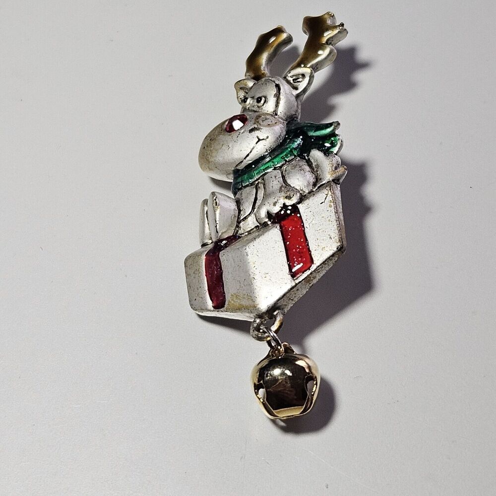 AJMC reindeer on a christmas gift Christmas pin vintage silver tone